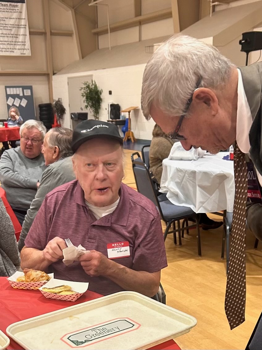 David listens to a constituent at the Polish Heritage dinner