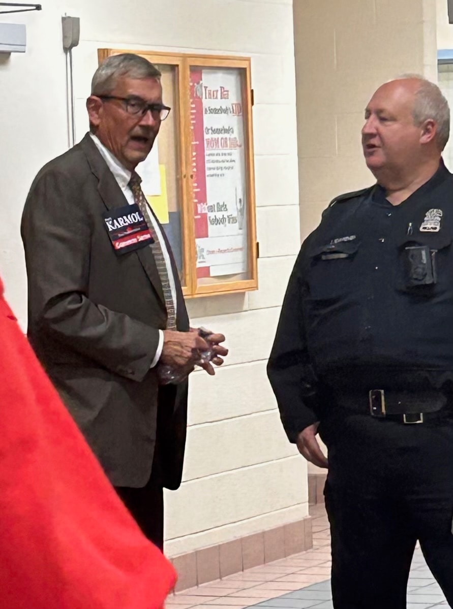 David speaks with a Toledo Police Department officer on the campaign trail